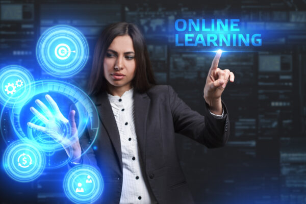 The concept of business, technology, the Internet and the network. A young entrepreneur working on a virtual screen of the future and sees the inscription: Online learning